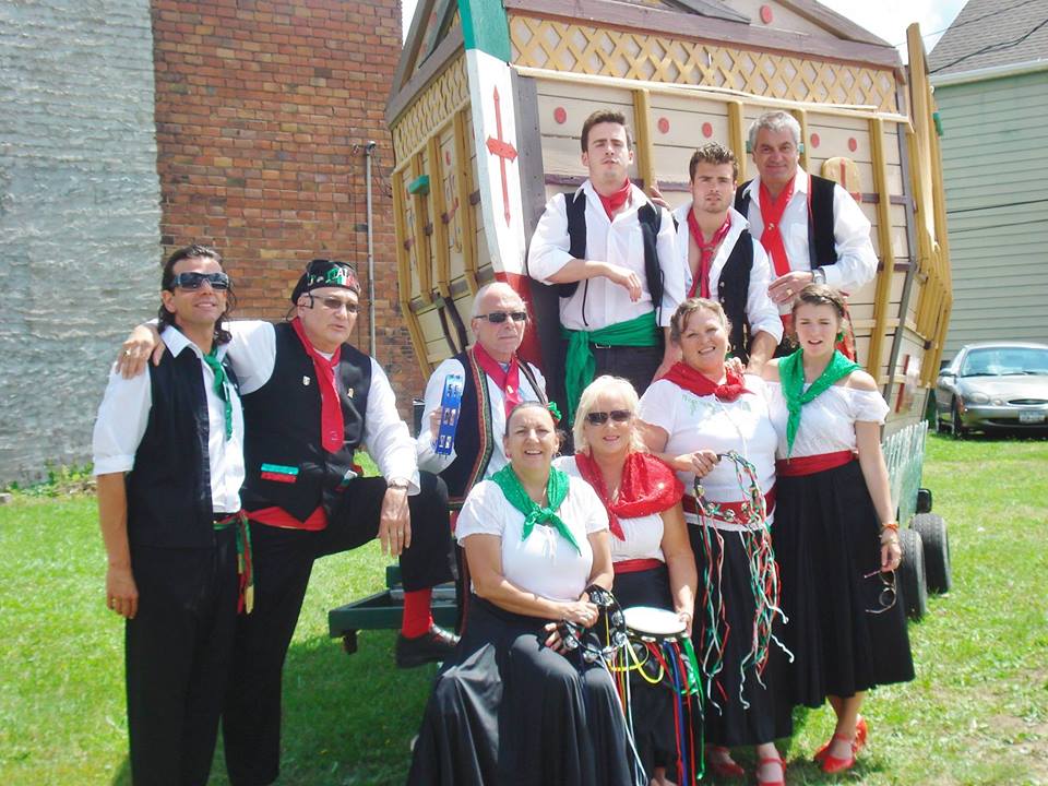 group of people dressed in Italian ethnic wear posing for a photo