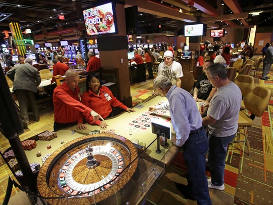 People playing table games inside the Lady Luck Casino Nemacolin in Pennsylvania