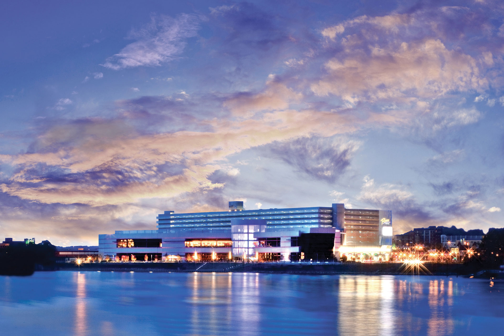 An exterior picture of Rivers Casino and the Ohio River at dusk in Pittsburgh, Pennsylvania