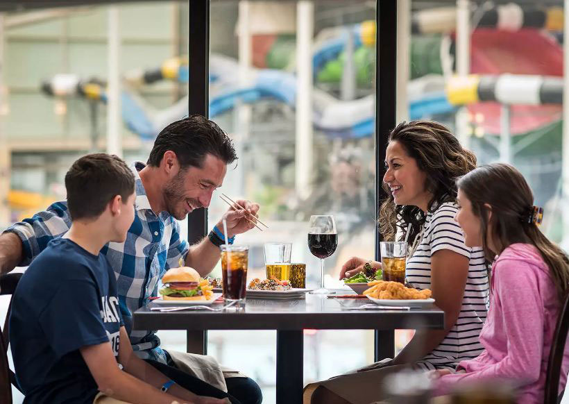 family having lunch at Aquatopia Indoor Water Park