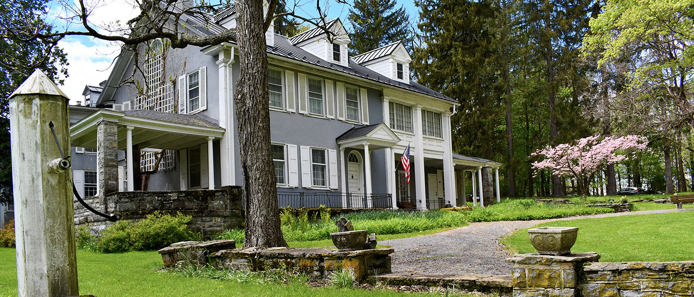 A house with Green lush lawn infront