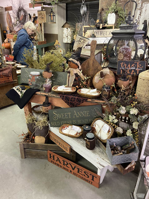 a women looking at Antique inside store