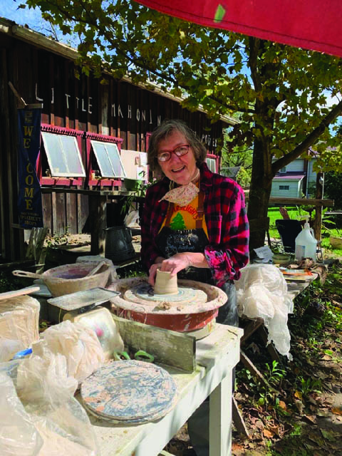 a women doing pottery