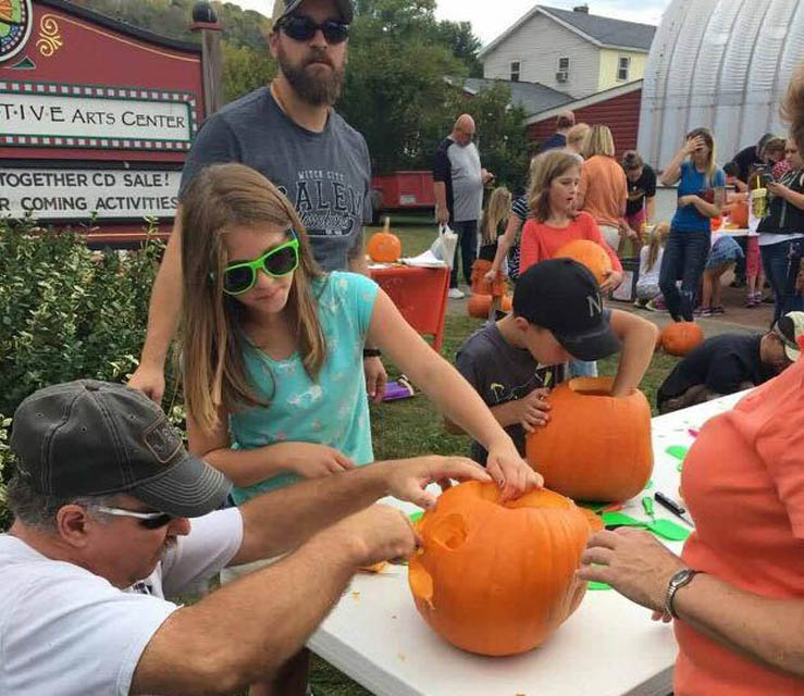 kids carving pumpkin
