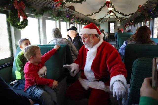 kids chatting with Santa on Train