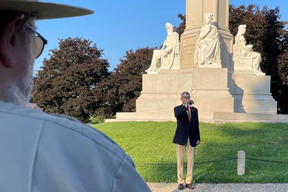 a person holding bullhorn making announcement