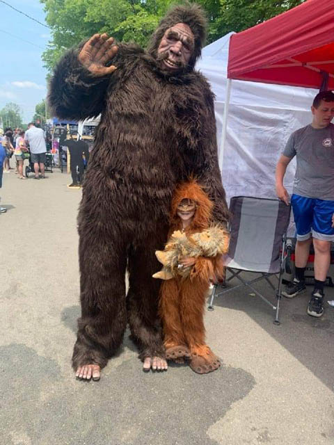 a kid and adult dressed as bigfoot