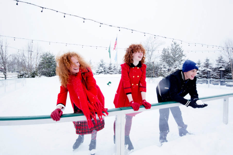 three people on rink