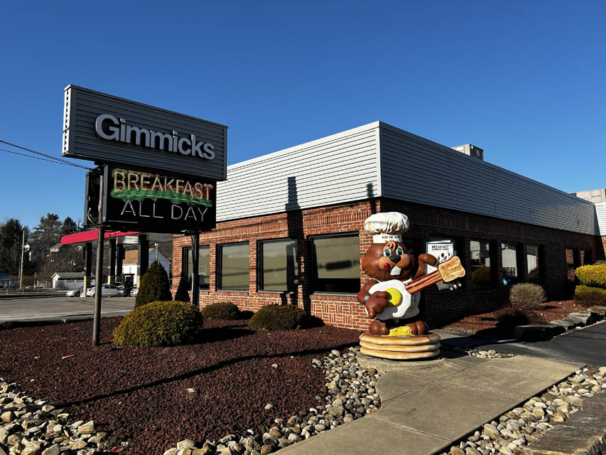 groundhog statue infront of restaurant building