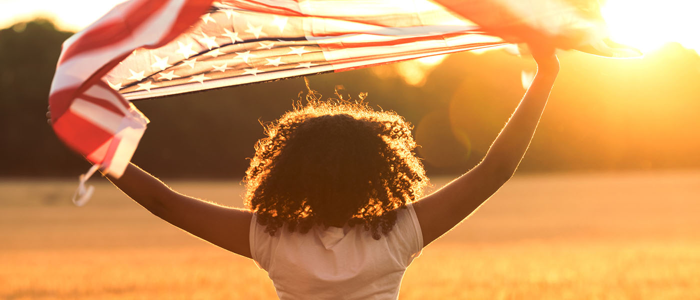 a girl holding flag