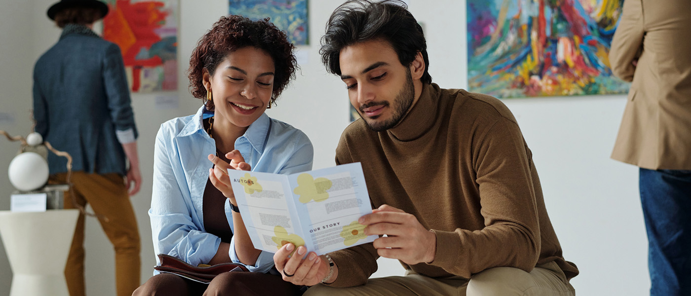 two people looking at a card