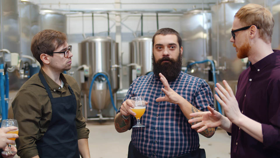 patrons getting guided tour of beer making