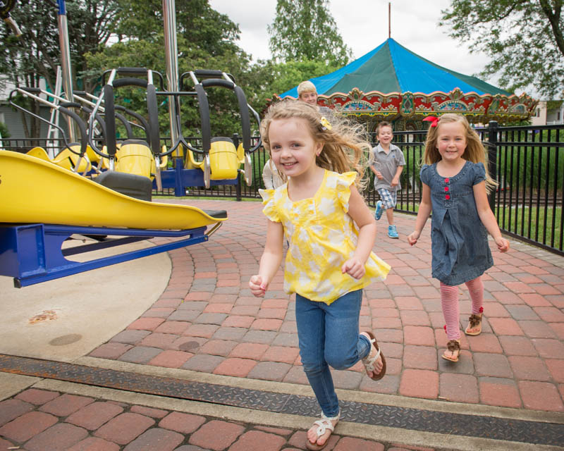 kids running around theme park