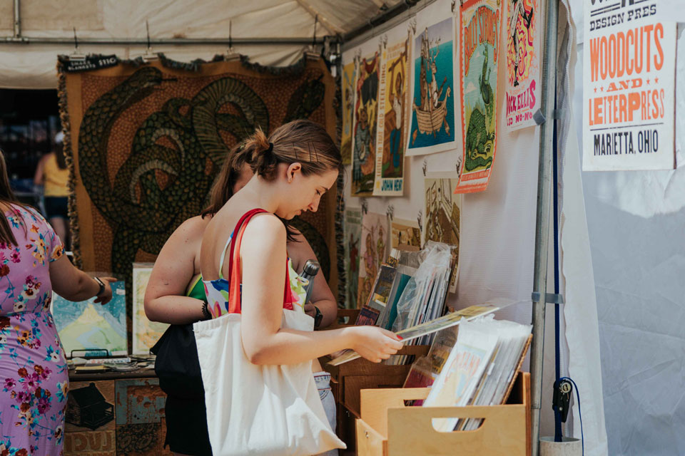 patrons looking at art works