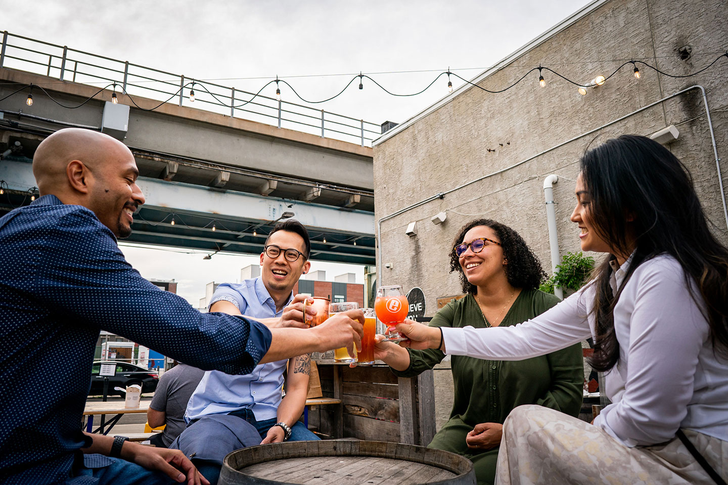 group of people enjoying beer cheering