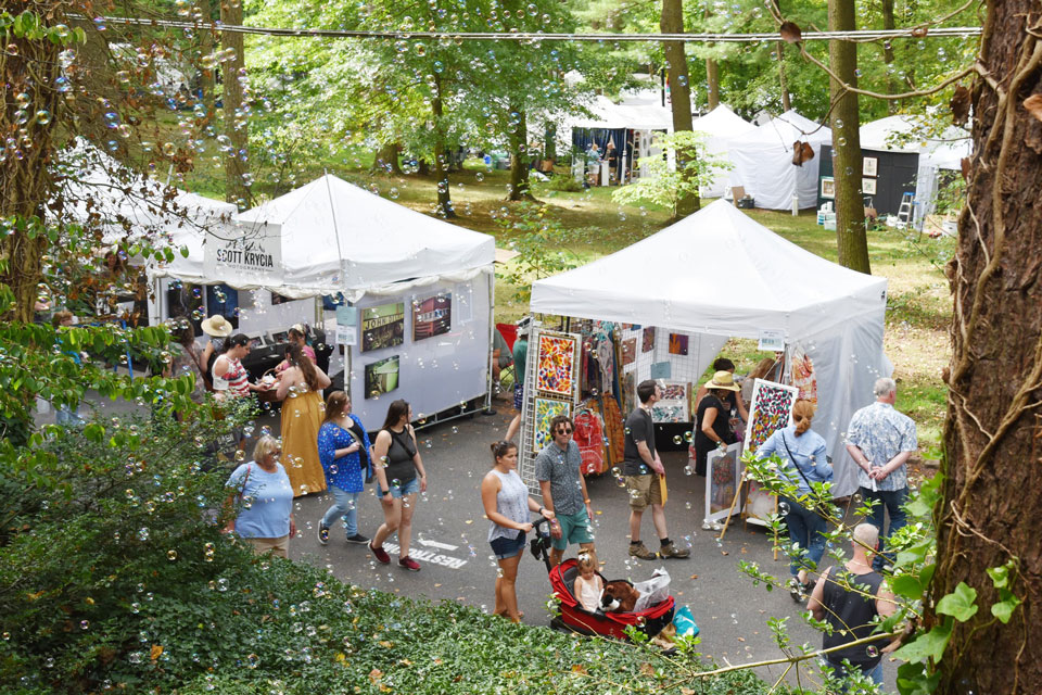 people enjoying outdoor art show