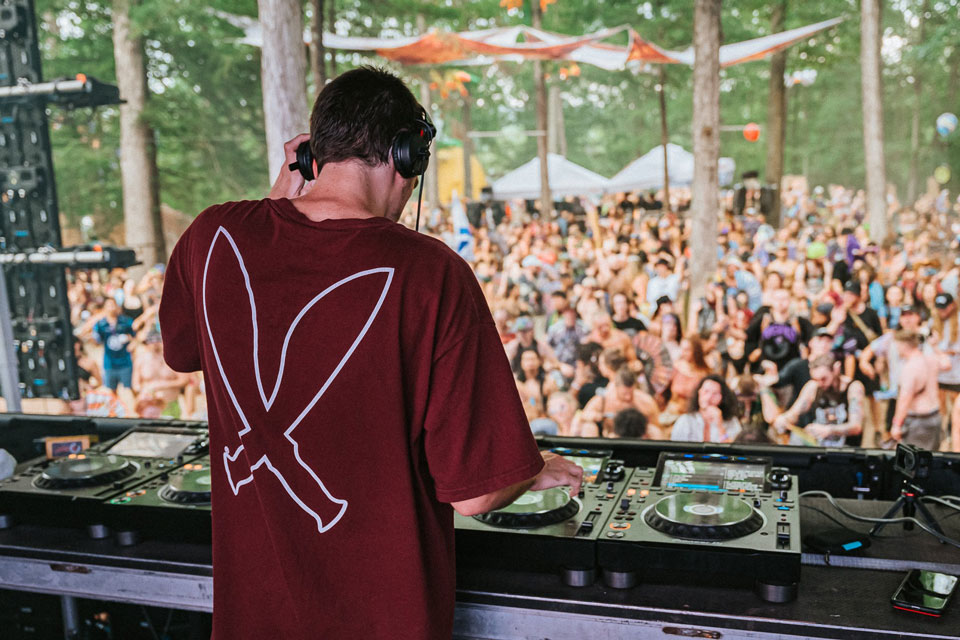 dj performing in front of crowd