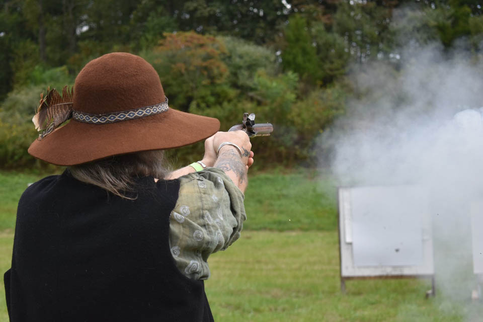 a person firing a muzzle