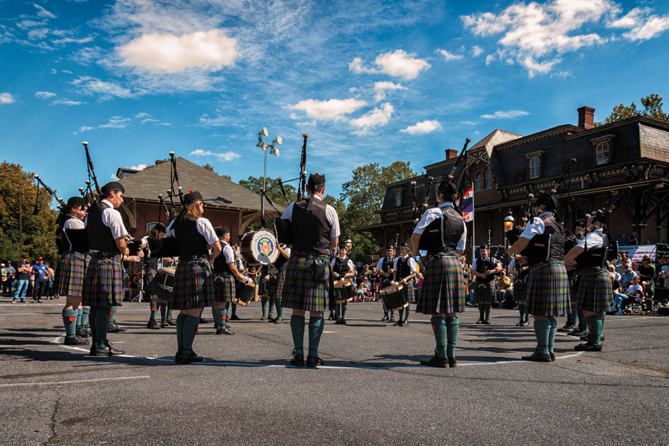scottish band performing on main street with bagpiper and drums