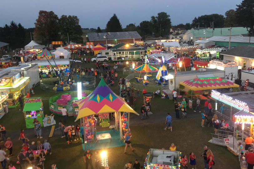 rides and vendor stall at Cookport Fair