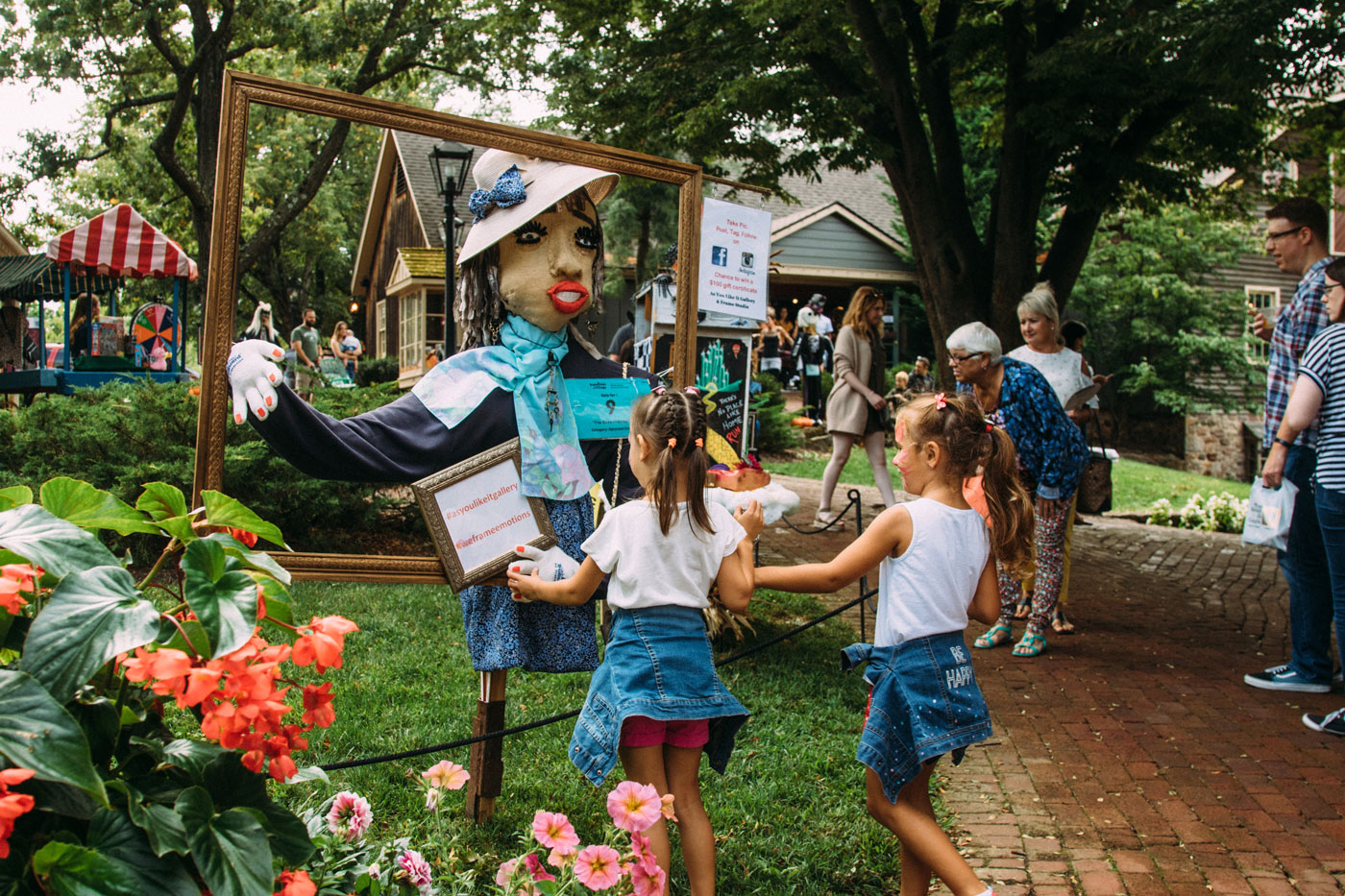 kids looking at a Scarecrow