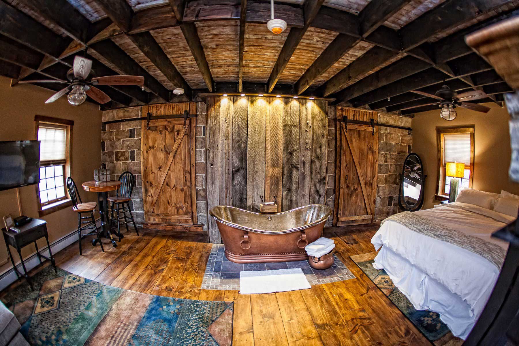 A room with a bed and a fireplace