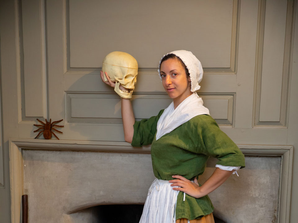 a women holding skull in hand