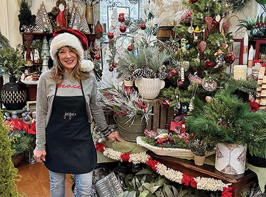 A women with Christmas hat on inside Christmas Decor store