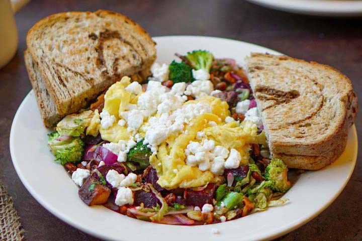 power bowl with eggs and cottage cheese with toast on side