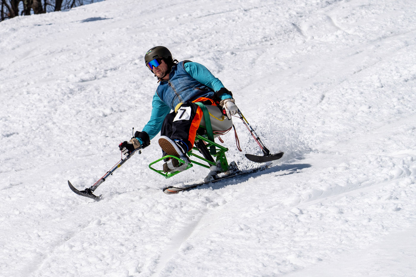 a mobility disabled person skiing with gear