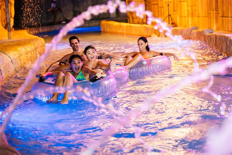 Family enjoying water tubing