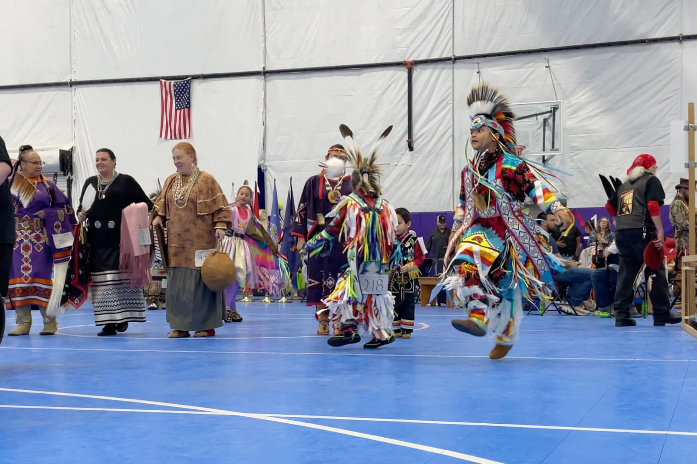 people performing dressed as indigenous people