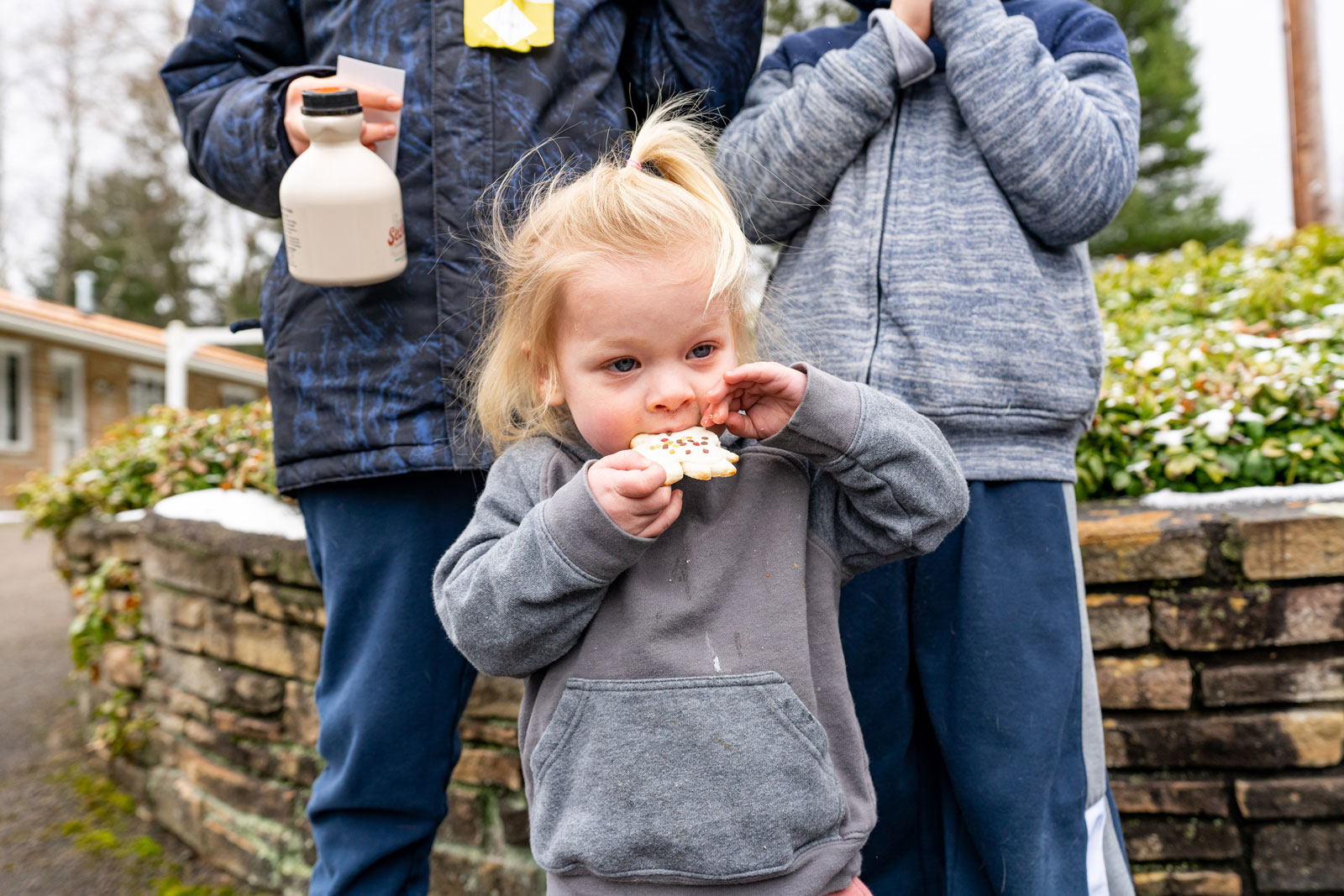 little girl eating a maple treat