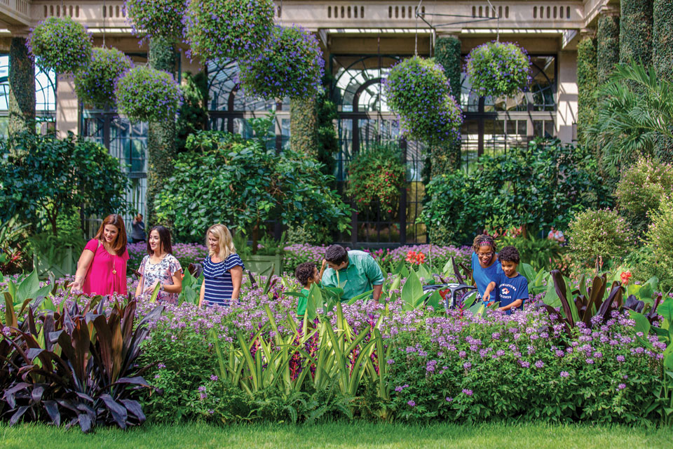 people inside indoor garden
