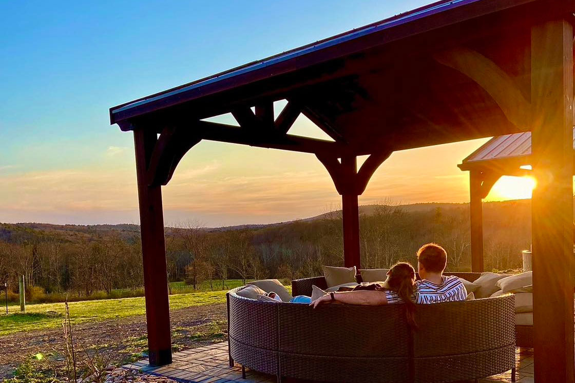 Couple enjoying sunset view at Mountain view Vineyard