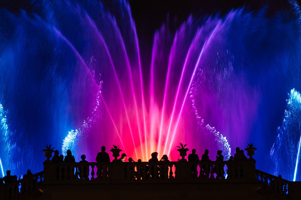 Longwood gardens fountain show at night with colorful lights
