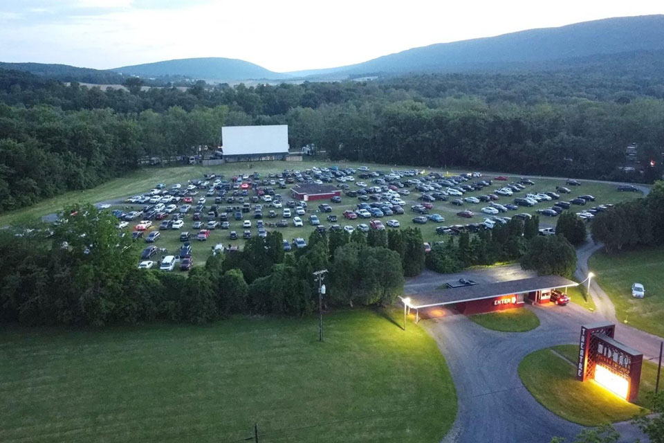 aerial view of cars parked in front of screen at Midway drive-in theater