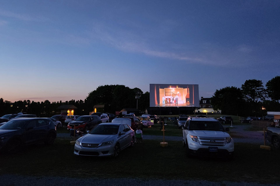 Patron watching Movie playing in drive-in theater outdoor
