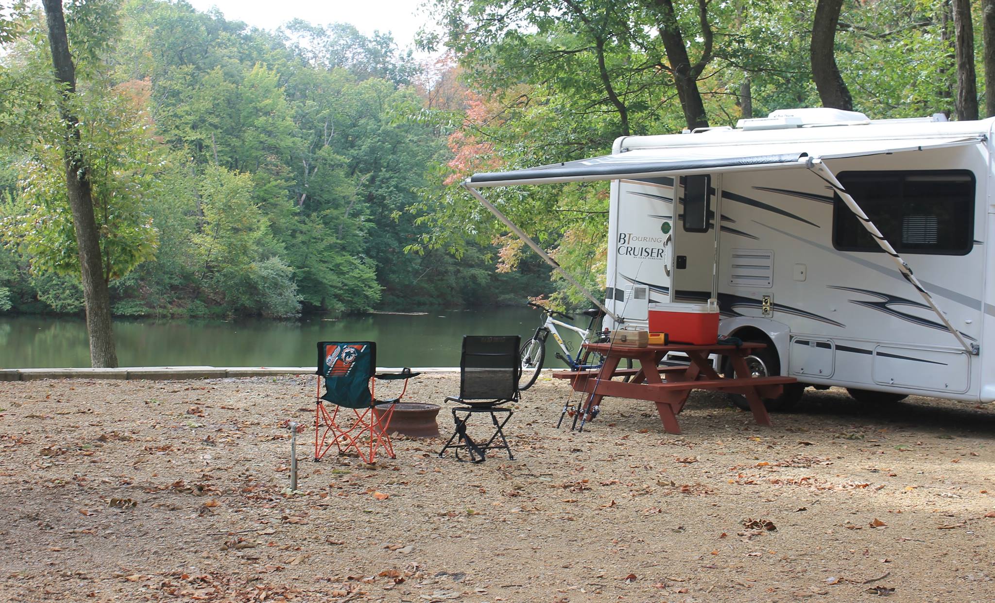RV camper parked by lake