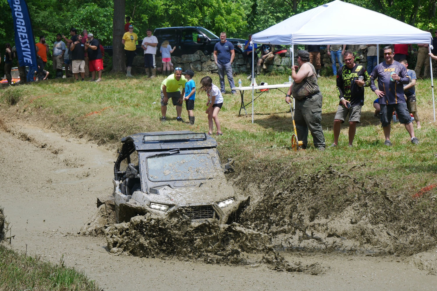 competing on muddy trails with ATV