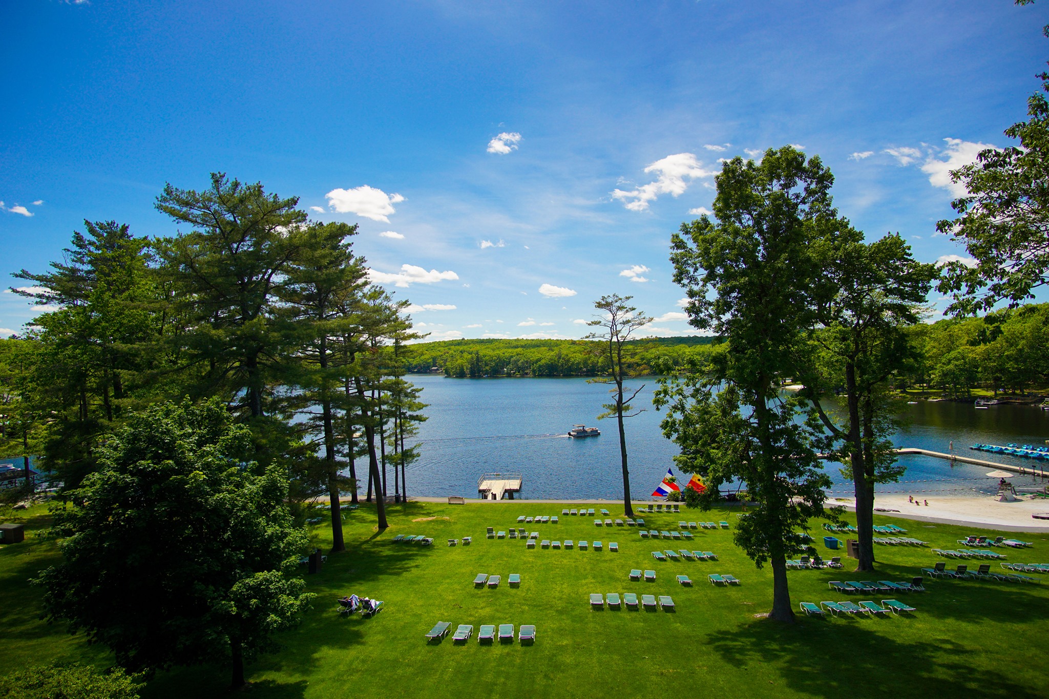 Lake with beach at Woodloch Pines Resort