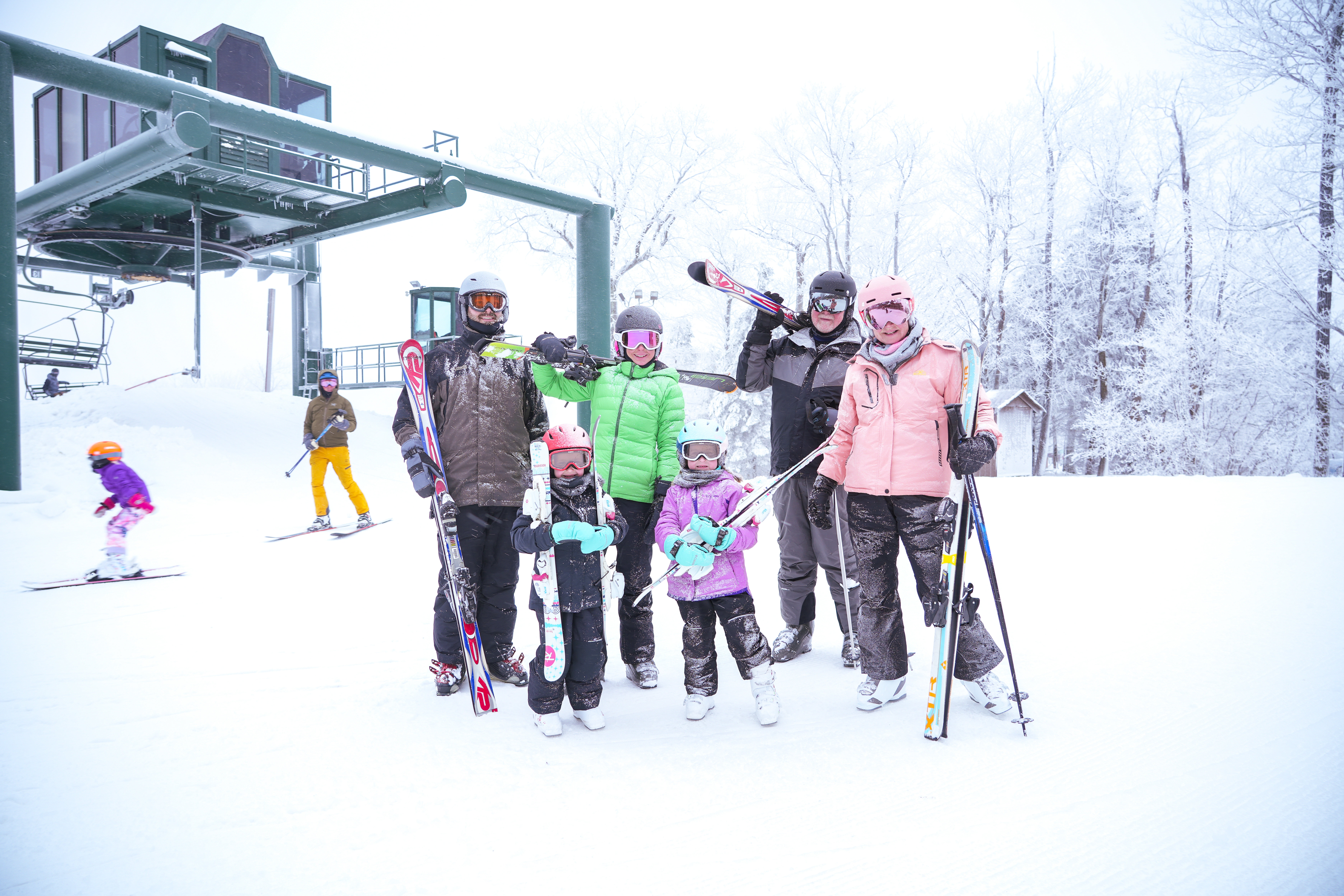 Family posing with Ski Boards