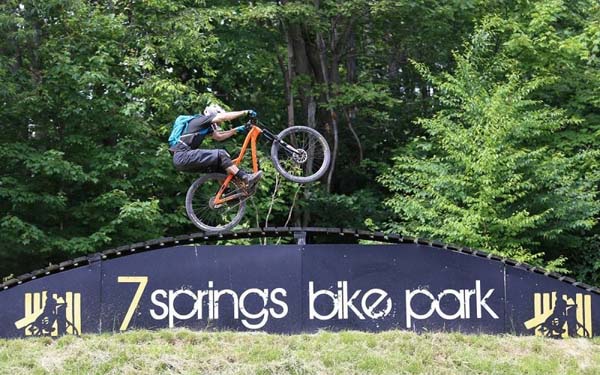 biker performing stunts seven spring bike park