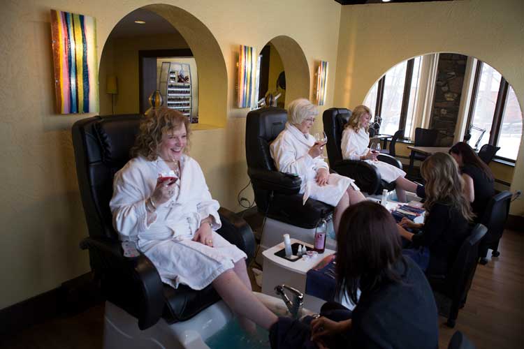 Elderly ladies getting foot spa with Drinks in hands