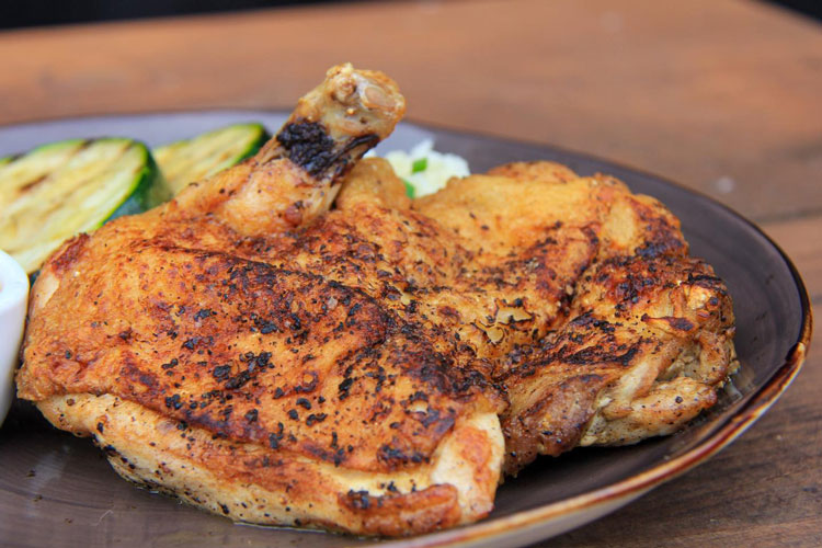 Grilled Chicken Leg Quarter served on plate