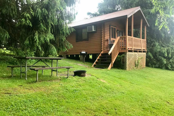 a bench to sit infront of cabin