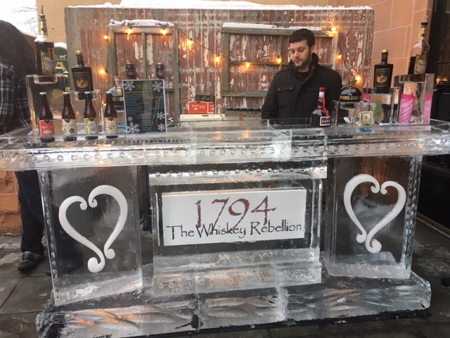 a person behind bar counter made of ice