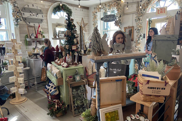 women inside a house style craft store