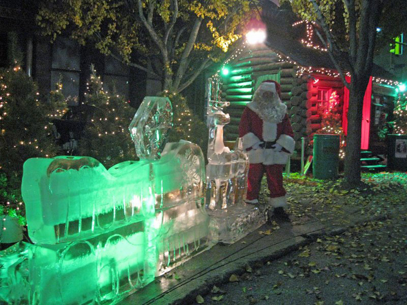 Ice sculptures next to santa on main street