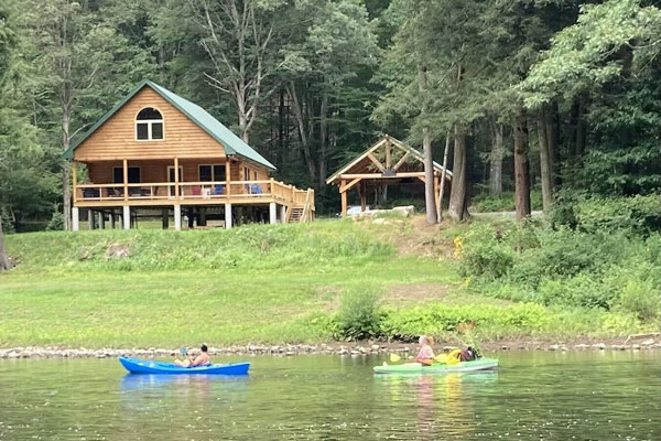 people kayaking on Clarion river by Log Cabin